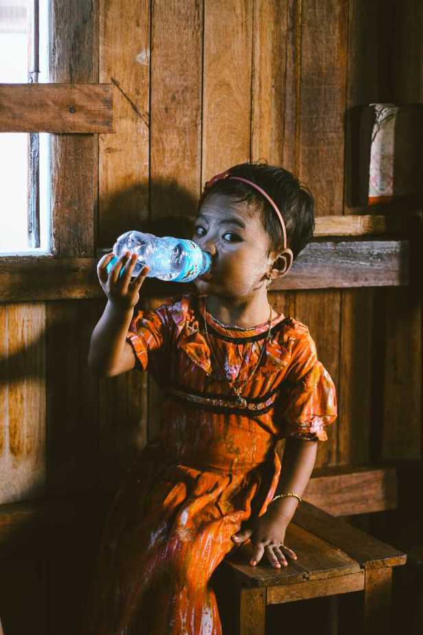 Image of little girl drinking mineral water