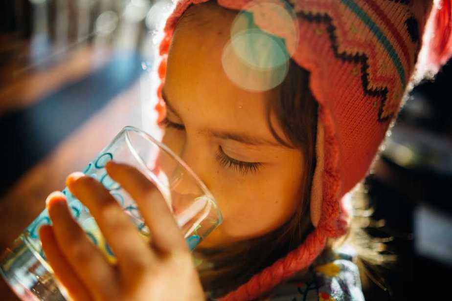 Image of a child drinking purified water